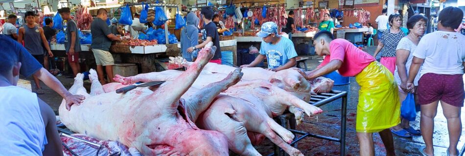 Buying meat early in the morning at the market