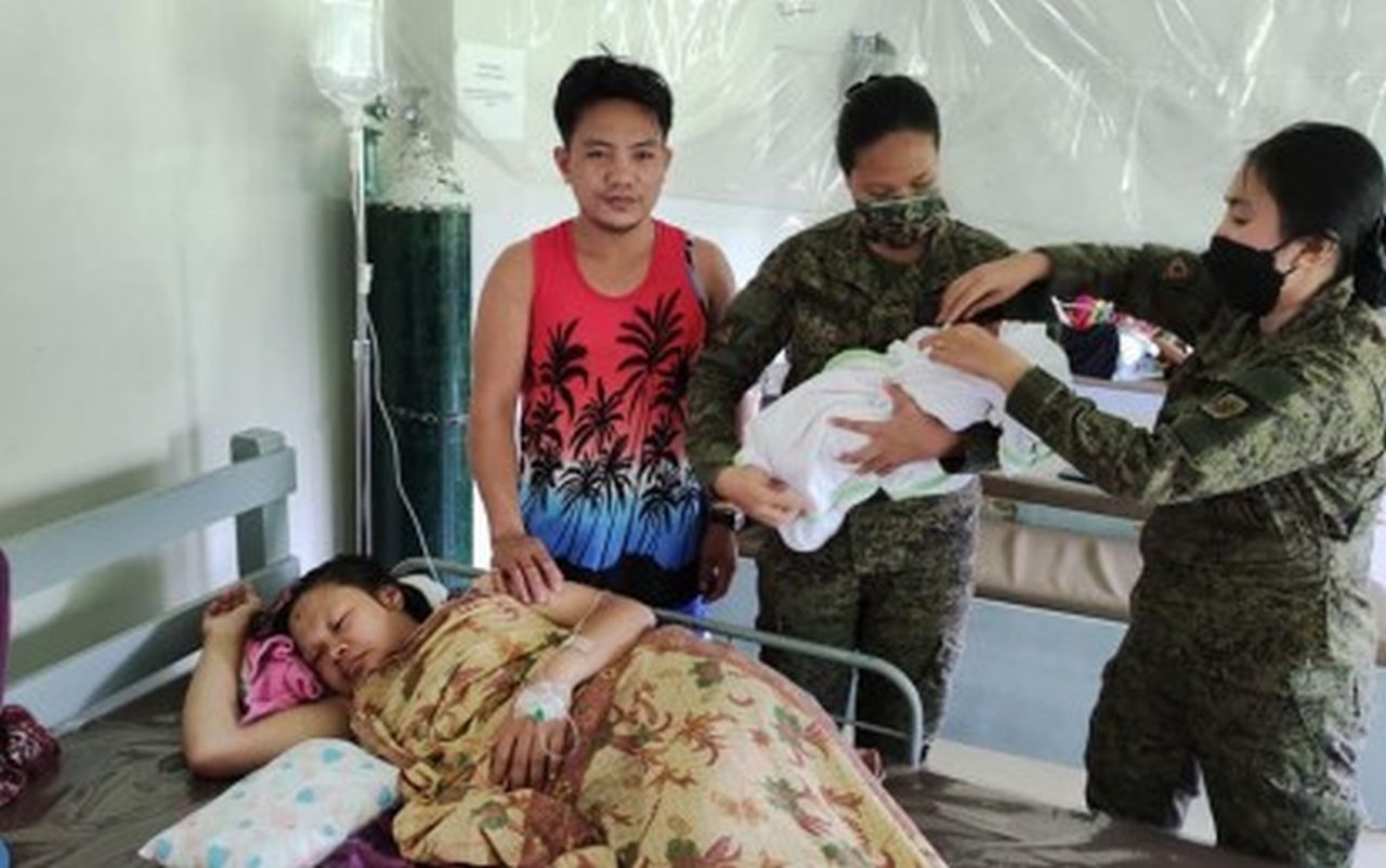 Military aids ex-NPA female fighter during childbirth