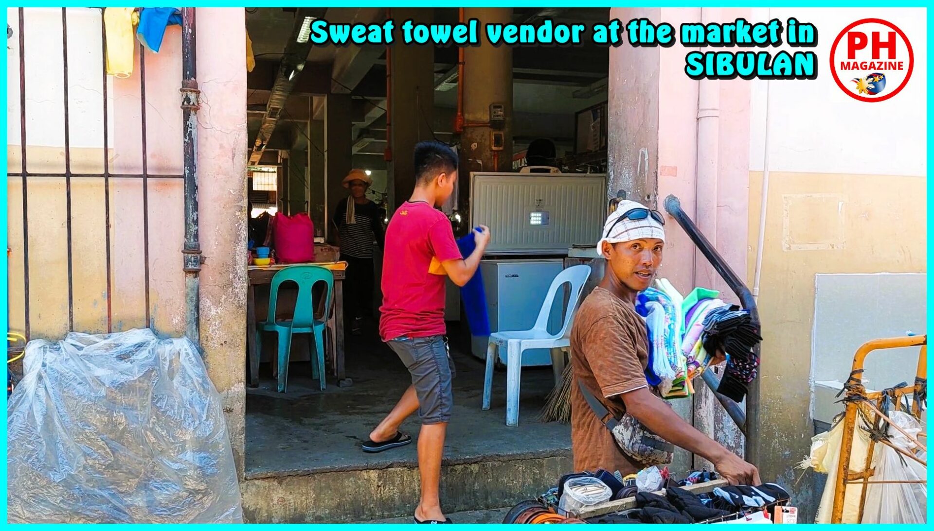 SIGHTS OF NEGROS - PHOTO OF THE DAY -Sweat towel vendor at market in Sibulan