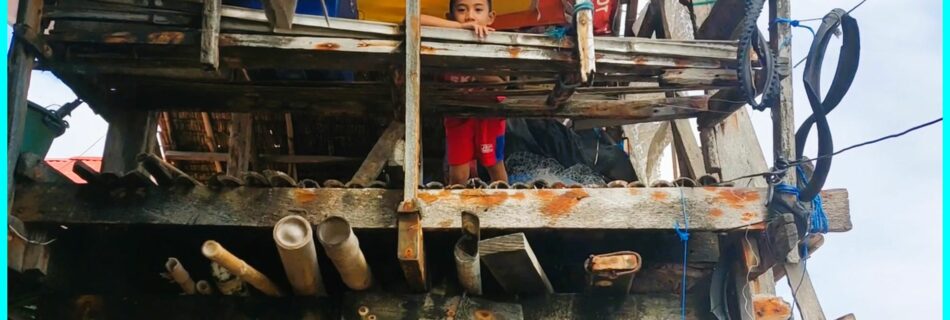 Photo of the Day for April 06, 2024 – Day dreaming boy at a fishing village in Dumaguete