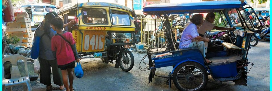 Photo of the Day for April 15, 2024 – Vibrant Life at the Dumaguete Public Market: A Pedicab Portrait